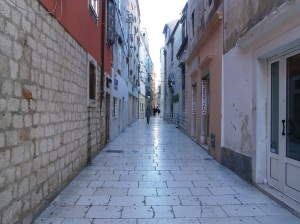If you ask a local where "Greasy Street" is located they will know exactly where you are talking.  This street is where all of the butcher shops were located and where street vendors made food.  Today it is lined with clothing stores and cafes.  The stone walkway is really shiny however.